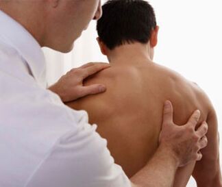 A neurologist examines a patient with signs of cervical spondylosis